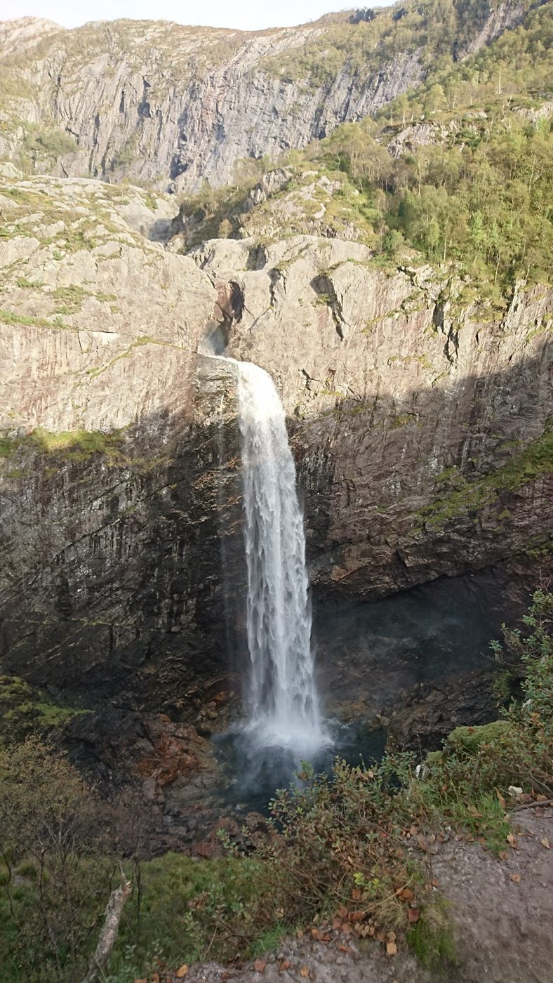 Månafossen waterfall dropping into a narrow canyon
